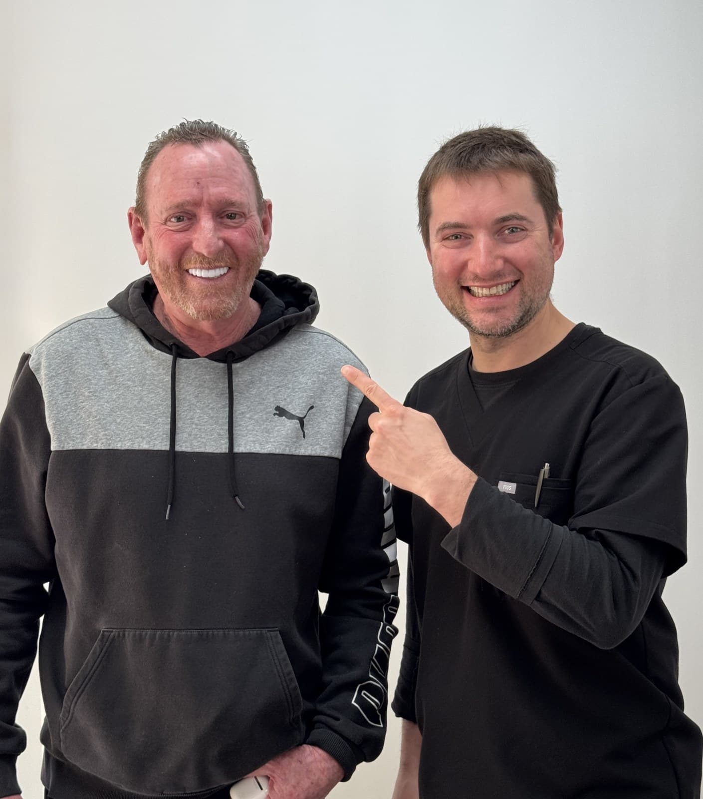 Dr. Alexander Antipov with a happy full-arch implant patient in Roseville, CA