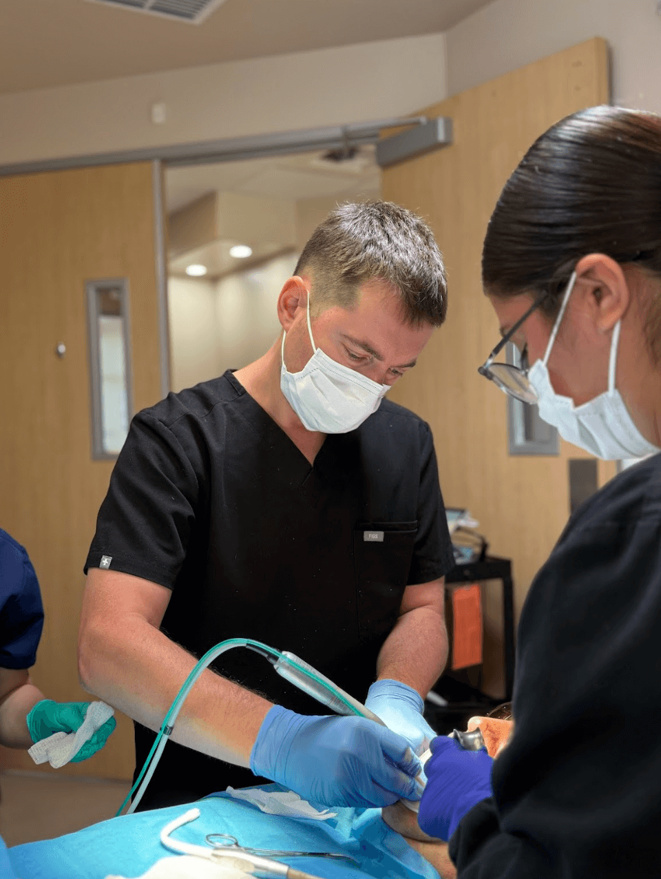 Dr. Alexander Antipov performing implant surgery