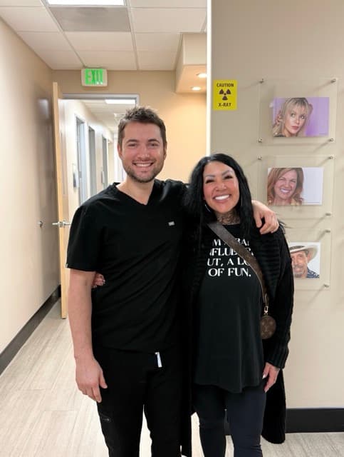 Dr. Alexander Antipov with a delighted patient at his Northern California surgical center