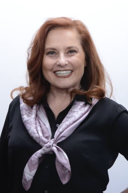 Patient smile result after full-arch dental implant restoration