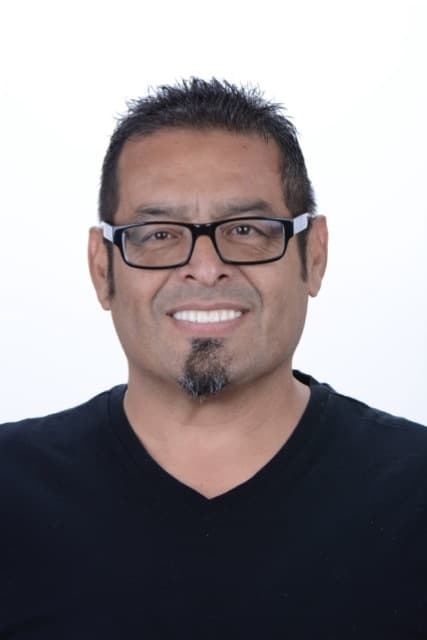 Male patient smiling after dental implant treatment