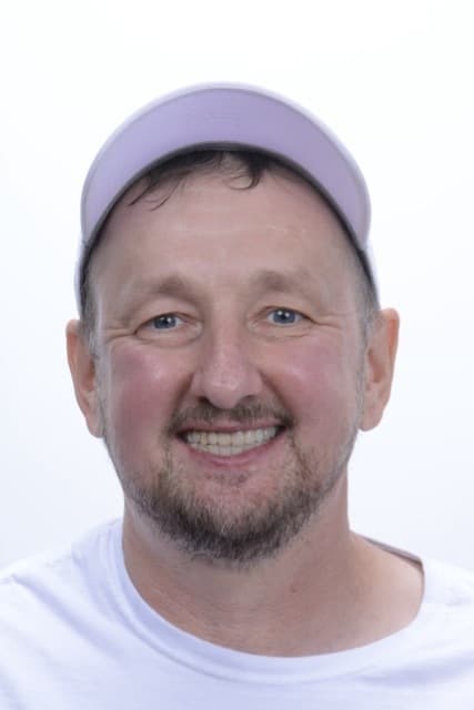 Male patient smiling after dental implant treatment