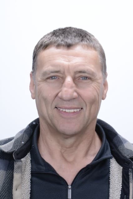 Male patient smiling after dental implant treatment